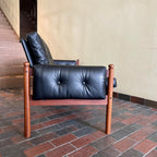 Side view of RS Associates teak sofa with compact profile