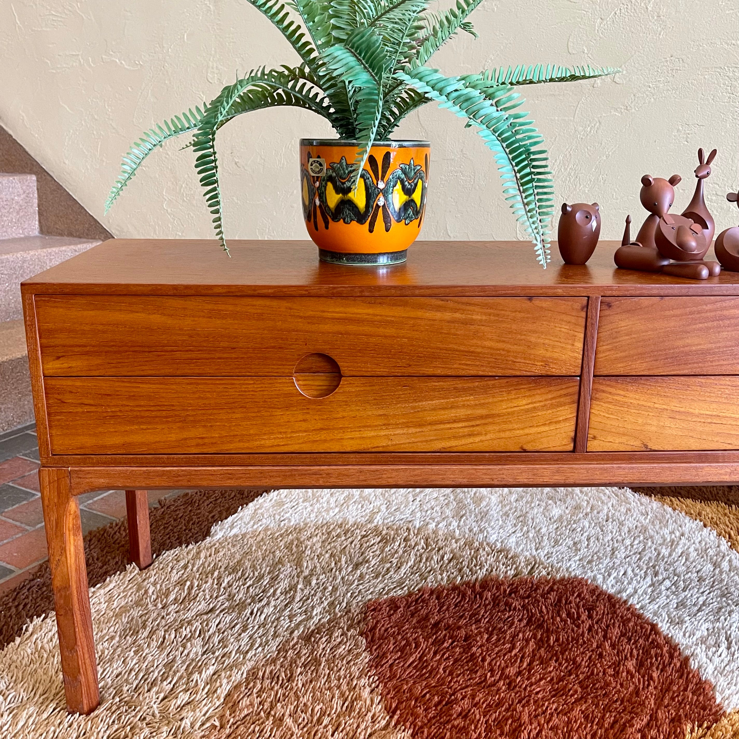 Designed by renowned Danish designer Kai Kristiansen, this piece embodies the clean lines, functional elegance, and exquisite craftsmanship characteristic of Scandinavian furniture design.