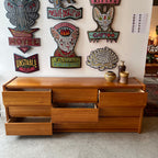 Mid-century teak dresser with nine drawers and low profile
