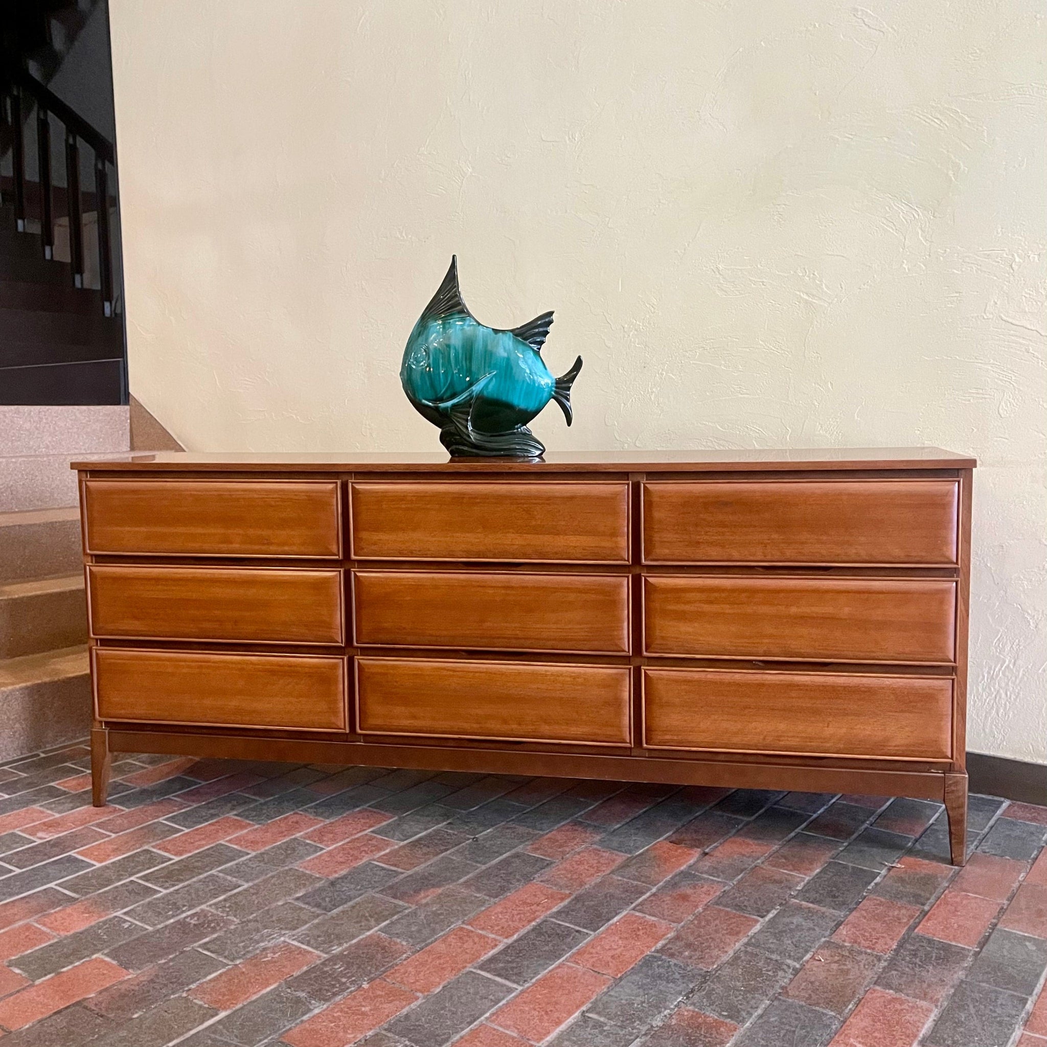 HPL Furniture nine drawer walnut dresser with mid-century profile
