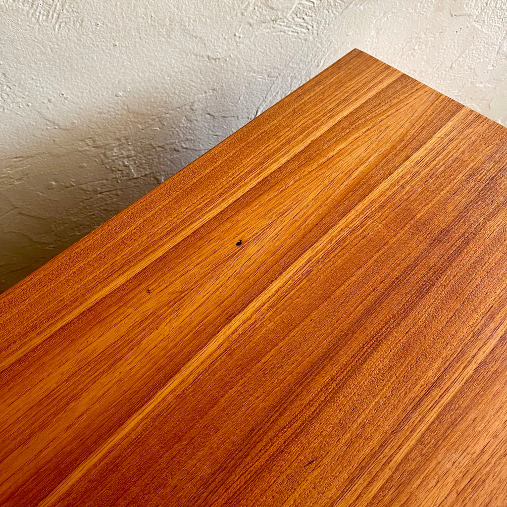 Close-up of beautiful teak grain on vintage R.S. Associates nine drawer dresser