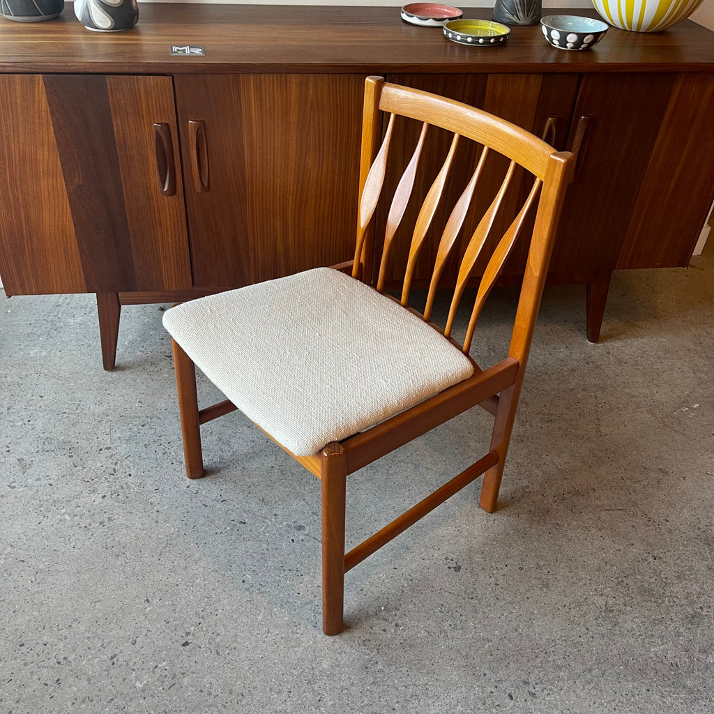 Angle top view of set of six teak dining chairs