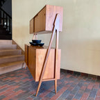 Two-tier Teak Danish Sideboard Credenza. The upper tier hosts a cabinet with sliding doors for storage. Below, sliding doors open to compartments with adjustable shelves, and drawers for small items. Solid sculptural teak legs tie the piece together. | Mr. Mansfield Vintage.