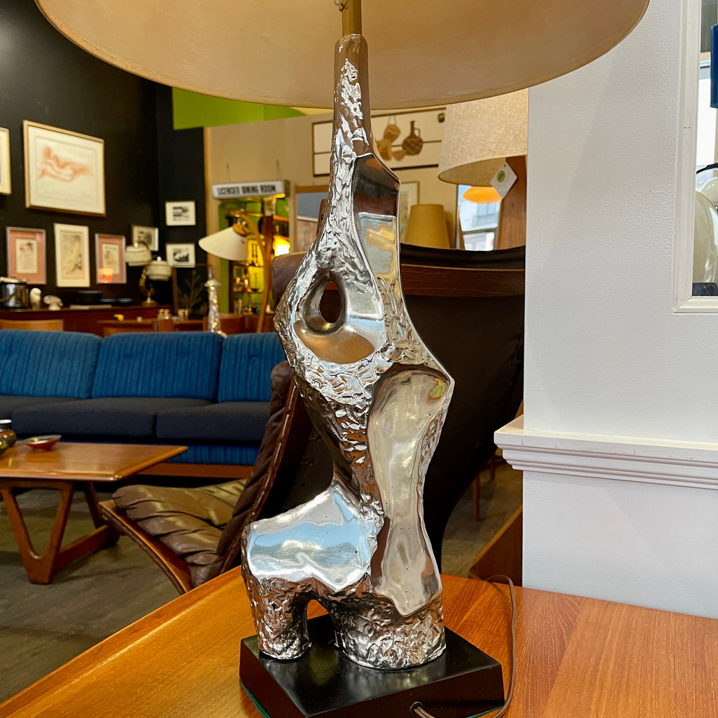 Richard Barr Brutalist Chrome Lamp for Laurel Lamp CoStanding as a testament to the Brutalist movement's influence on mid-century design, the lamp features a robust chrome base that exudes an air of strength and solidity. 