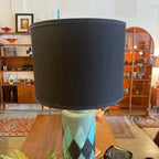 Front view of Bitossi ceramic table lamp with black drum shade