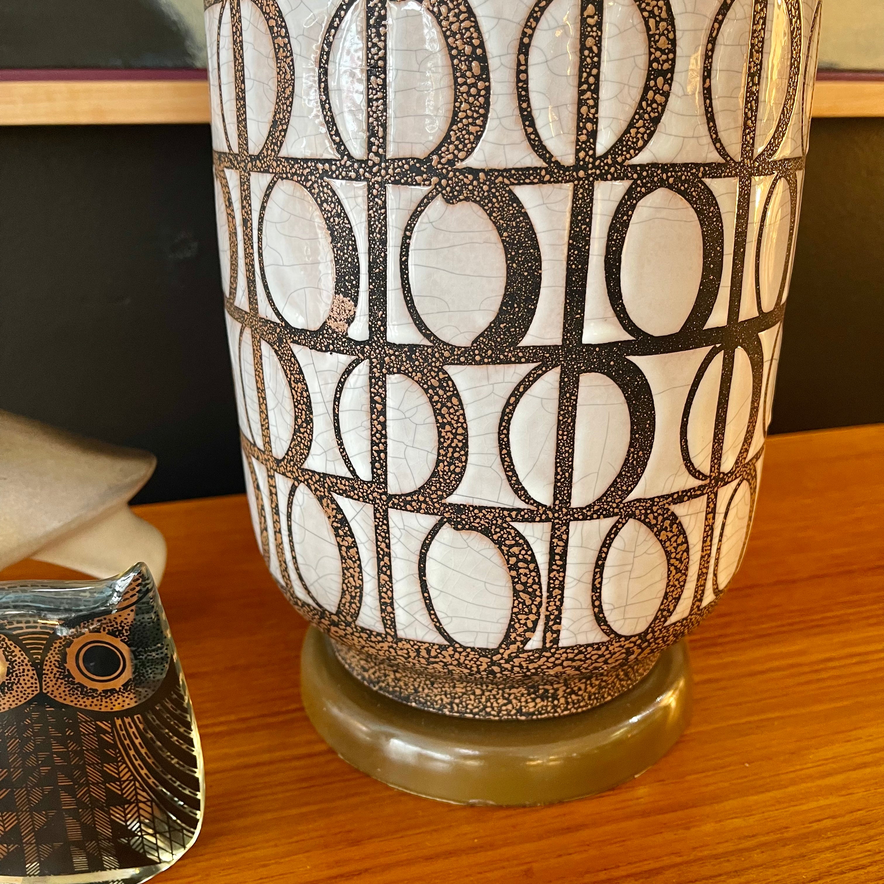  Mid Century Modern Pottery Lamp. Beautiful glazed geometric shapes adorn this pottery lamp. The  under glaze is black with brown specs and white glaze contrasting the shapes. | Mr. Mansfield Vintage 