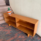  Mid-century Teak Credenza | Hutch with Adjustable Shelving. This mid-century teak credenza | hutch is perfect for storing and displaying your items. Featuring two adjustable shelves, you can customize the configuration to suit your unique home. The timeless design is ideal for both office and home environments.