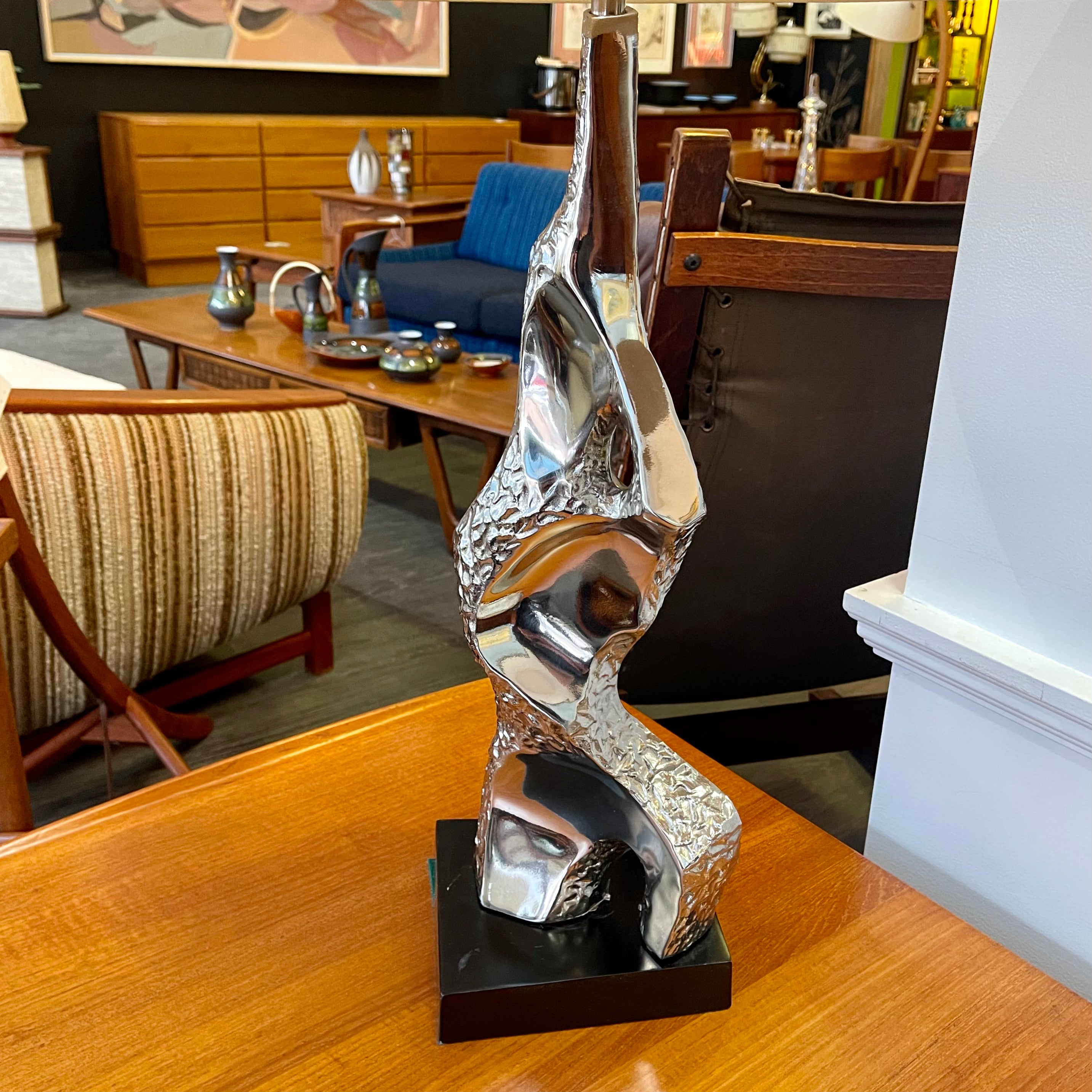 Richard Barr Brutalist Chrome Lamp for Laurel Lamp CoStanding as a testament to the Brutalist movement's influence on mid-century design, the lamp features a robust chrome base that exudes an air of strength and solidity. 