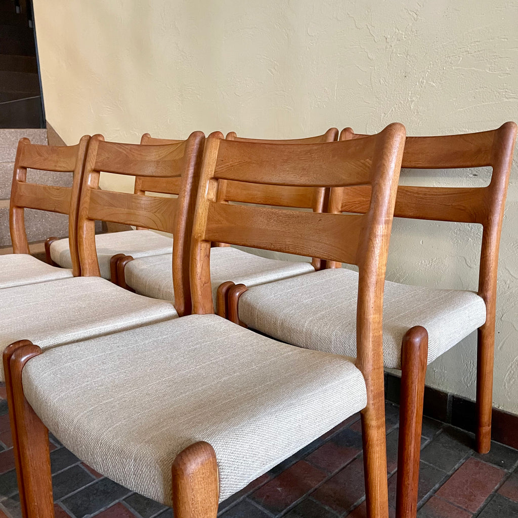 This set of six Danish Modern Solid Teak Dining Chairs from EMC Møbler showcase a sturdy craftsmanship and timeless design. Crafted from solid teak, these chairs feature a sleek and ergonomic silhouette, embodying the minimalist elegance characteristic of mid-century Danish furniture. 