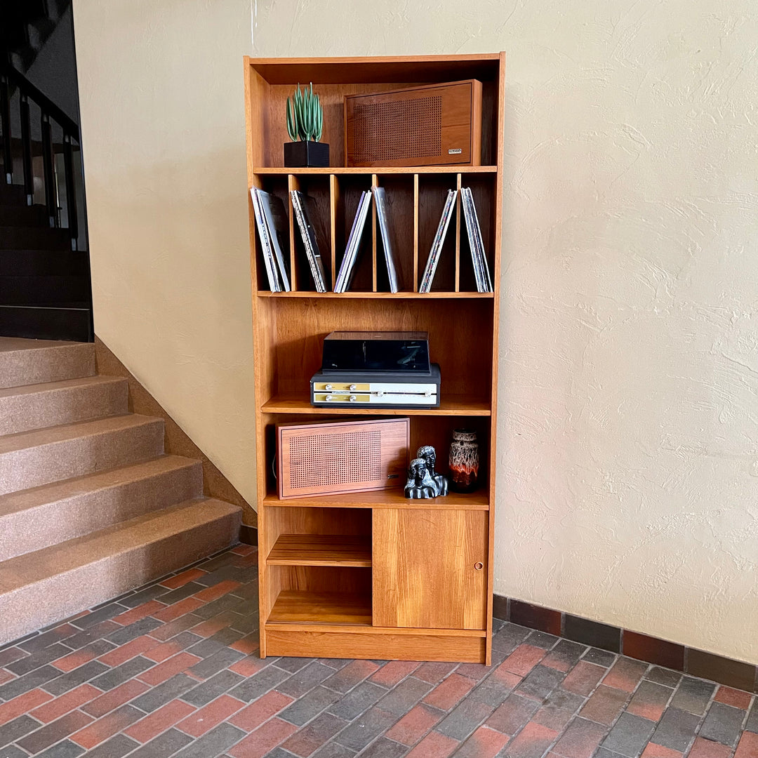 "Made in Denmark," this shelving unit not only provides a stylish platform to showcase your cherished records or favorite books but also offers functional storage solutions. 