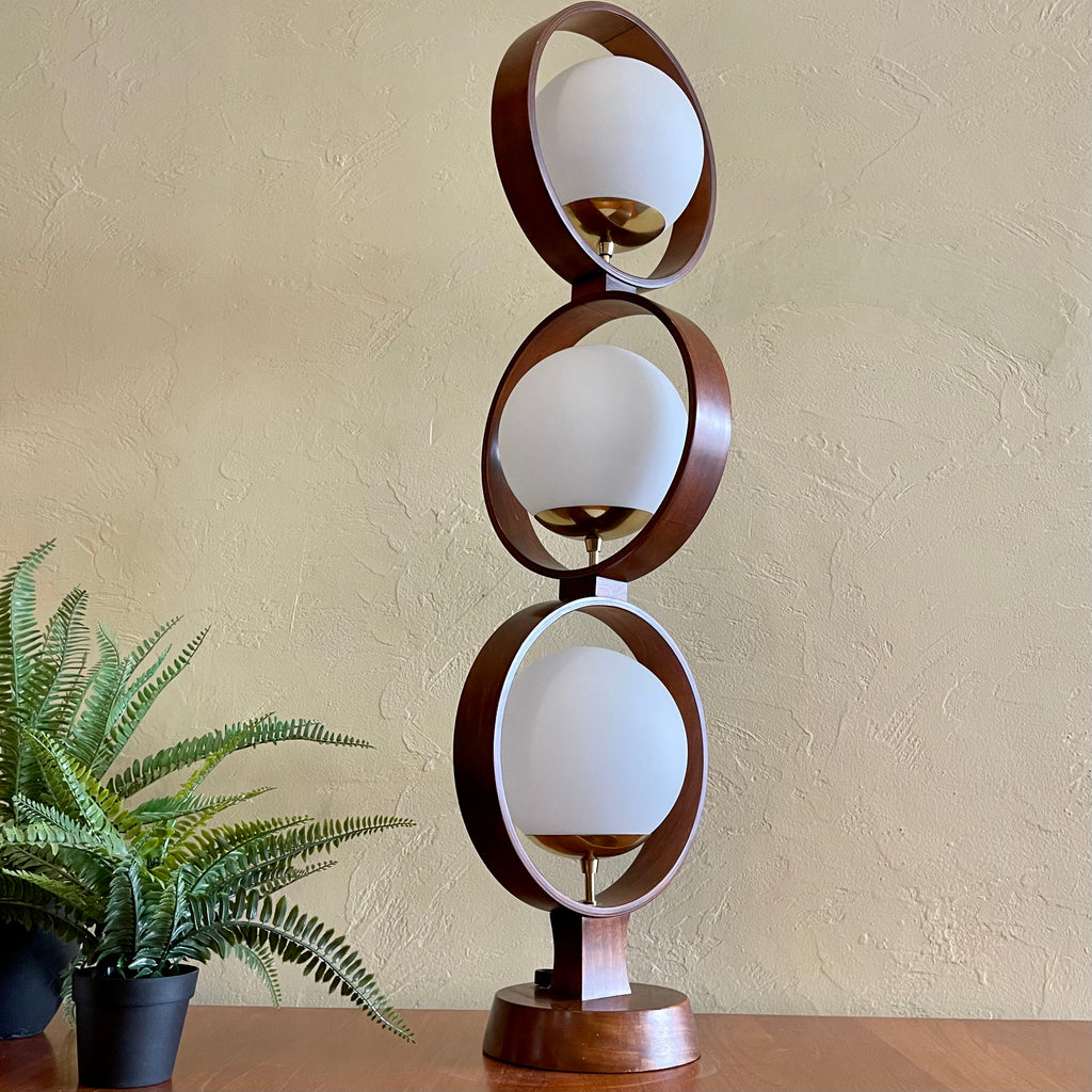 MODELINE Mid-Century Modern Globe Ring Lamp is a stunning three-tiered lighting fixture exuding a timeless Mid-Century Modern aesthetic. 