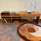 This versatile Adjustable Teak Entertainment Unit is an ideal fit for condo living. With ample storage including two drawers, it accommodates record collections and houses a stereo system