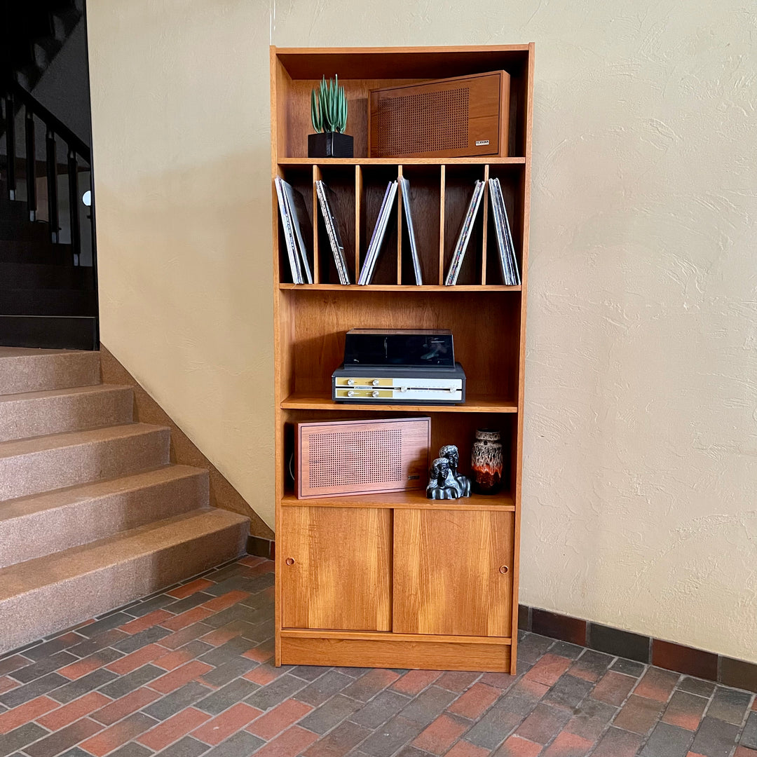 "Made in Denmark," this shelving unit not only provides a stylish platform to showcase your cherished records or favorite books but also offers functional storage solutions. 