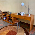 This versatile Adjustable Teak Entertainment Unit is an ideal fit for condo living. With ample storage including two drawers, it accommodates record collections and houses a stereo system