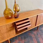 Mid Century Danish Teak Sideboard Credenza with sliding doors, showing inside drawers. Mr. Mansfield Vintage 