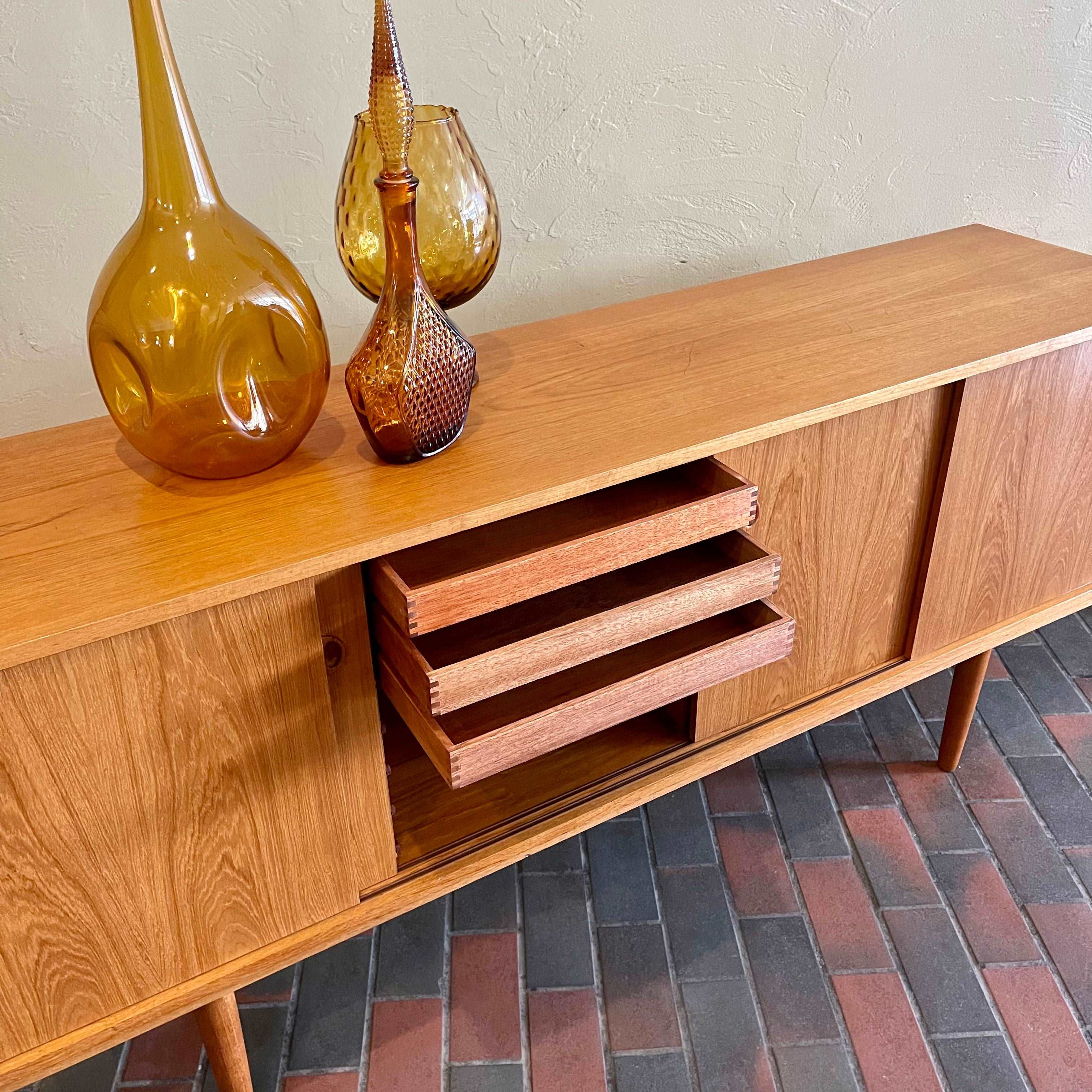 Mid Century Danish Teak Sideboard Credenza with sliding doors, showing inside drawers. Mr. Mansfield Vintage 