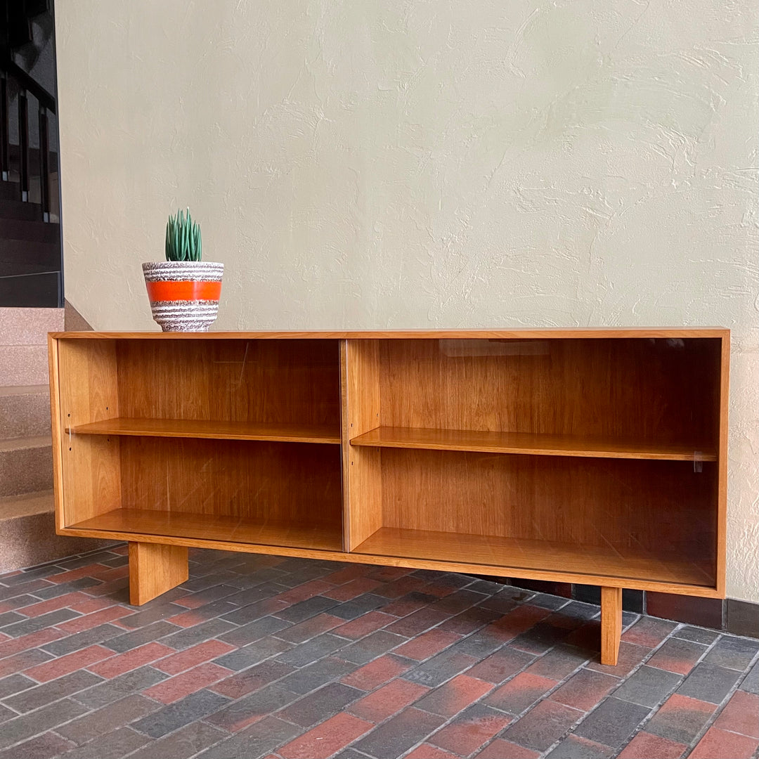  Mid-century Teak Credenza | Hutch with Adjustable Shelving. This mid-century teak credenza | hutch is perfect for storing and displaying your items. Featuring two adjustable shelves, you can customize the configuration to suit your unique home. The timeless design is ideal for both office and home environments.