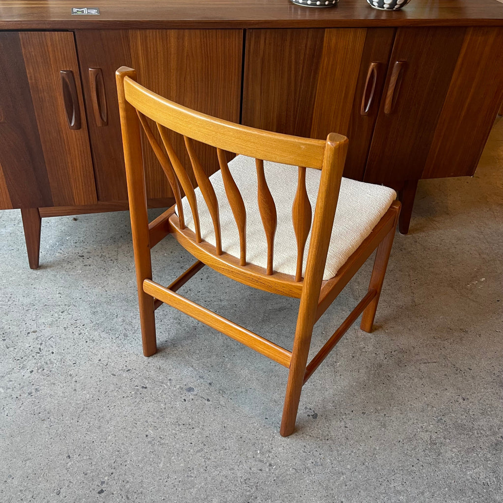 Back view of set of six solid teak dining chairs
