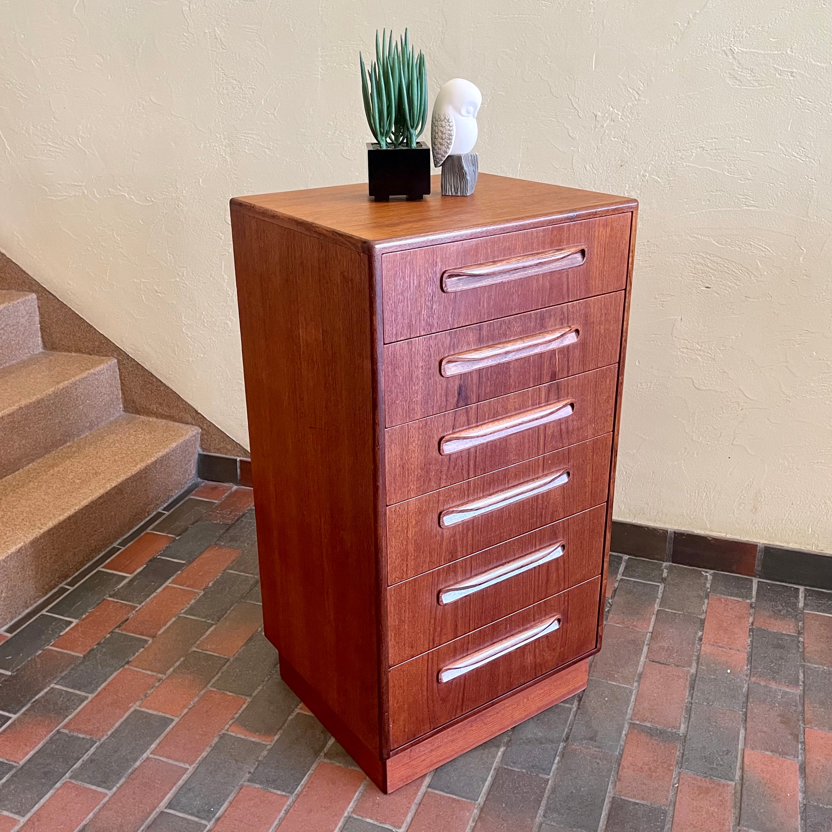 Angled view of vintage G Plan teak chest of drawers showing recessed handles and compact vertical profile