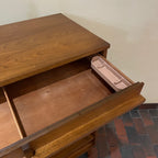 Crafted from rich walnut wood, this GIBBARD dresser boasts a warm, inviting tone that adds a touch of sophistication to any space.