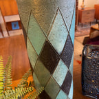 Close-up of turquoise and charcoal ceramic base on Bitossi lamp