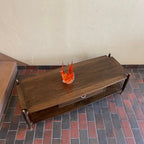 top view of Canada Cabinets and Furniture Limited walnut and mahogany coffee table with brass-capped legs and two way drawer