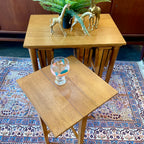 Mid Century Poul Hundevad Nesting Tables, a timeless and versatile addition to your living space. This exquisite set consists of five tables, with four of them ingeniously designed as drop-leaf tables that effortlessly slide beneath the main table, offering both functionality and aesthetic appeal.