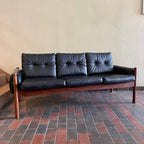 Vintage RS Associates sofa with black upholstery and teak frame