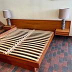 The centerpiece of any bedroom, this platform bed features a clean, minimalist design with a low-profile frame that offers a sense of spaciousness. The headboard, showcasing the natural beauty of teak, adds a touch of organic allure to the overall aesthetic. Its seamless integration with the floating nightstands on both sides creates a cohesive and balanced look.