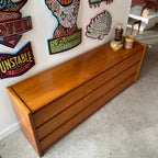 Teak grain detail on mid-century nine drawer dresser