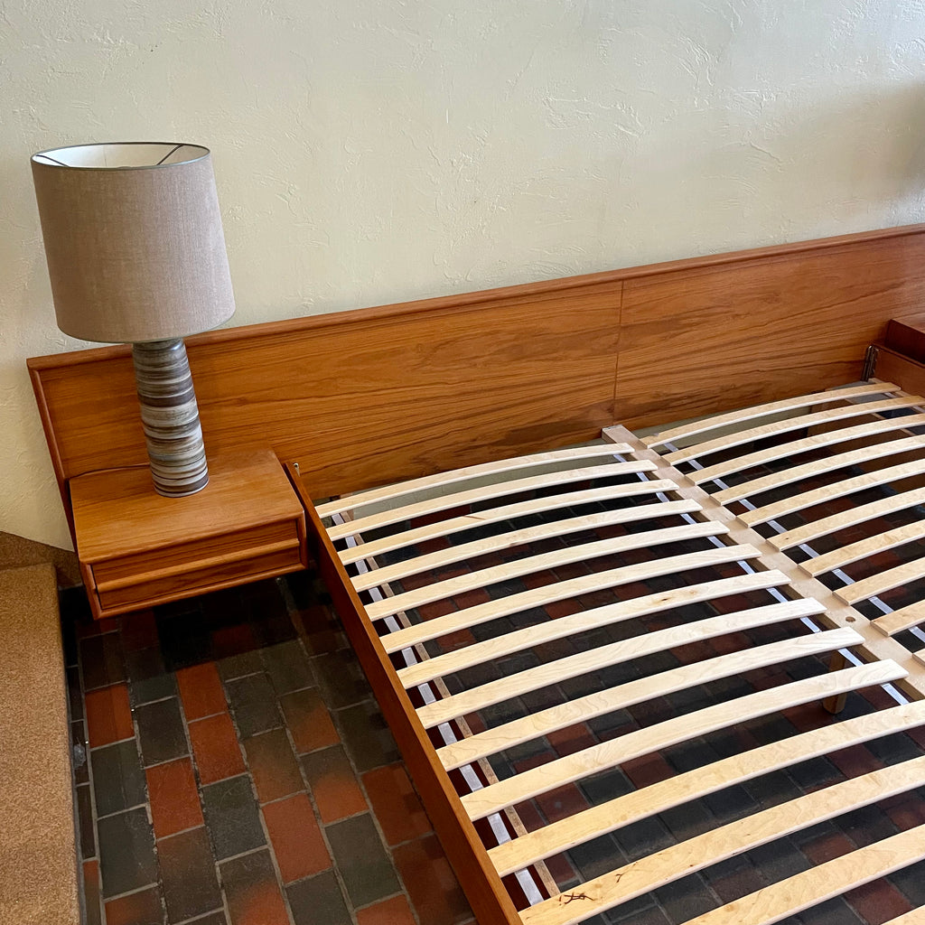 The centerpiece of any bedroom, this platform bed features a clean, minimalist design with a low-profile frame that offers a sense of spaciousness. The headboard, showcasing the natural beauty of teak, adds a touch of organic allure to the overall aesthetic. Its seamless integration with the floating nightstands on both sides creates a cohesive and balanced look.