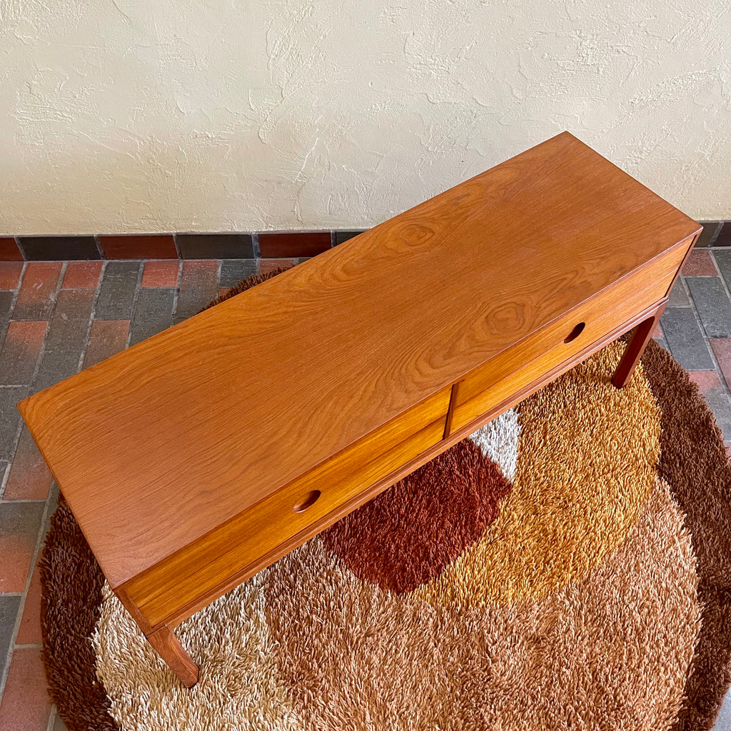 Designed by renowned Danish designer Kai Kristiansen, this piece embodies the clean lines, functional elegance, and exquisite craftsmanship characteristic of Scandinavian furniture design.