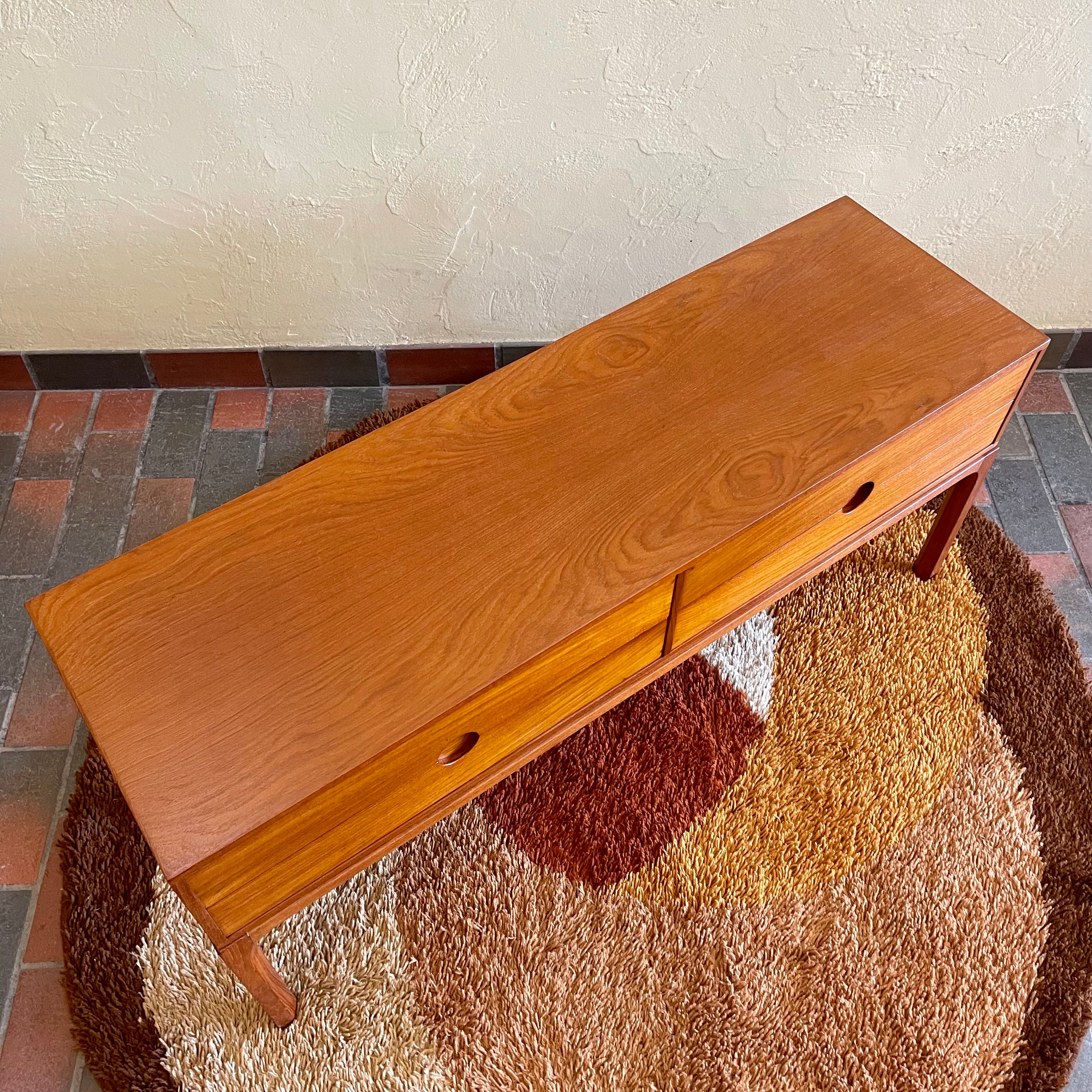 Designed by renowned Danish designer Kai Kristiansen, this piece embodies the clean lines, functional elegance, and exquisite craftsmanship characteristic of Scandinavian furniture design.