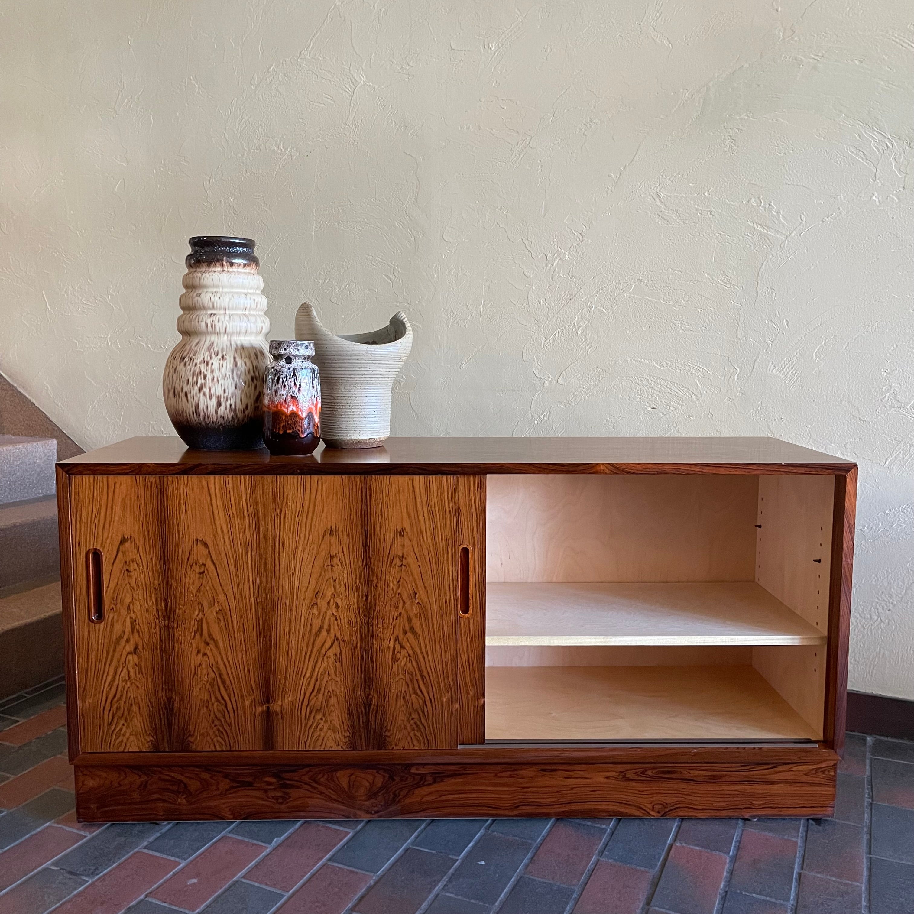This Poul Hundevad Rosewood Credenza is crafted from rosewood, its compact size makes it perfect for apartments or smaller rooms.
