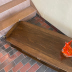 wider view of walnut and mahogany wood grain on vintage Canadian coffee table