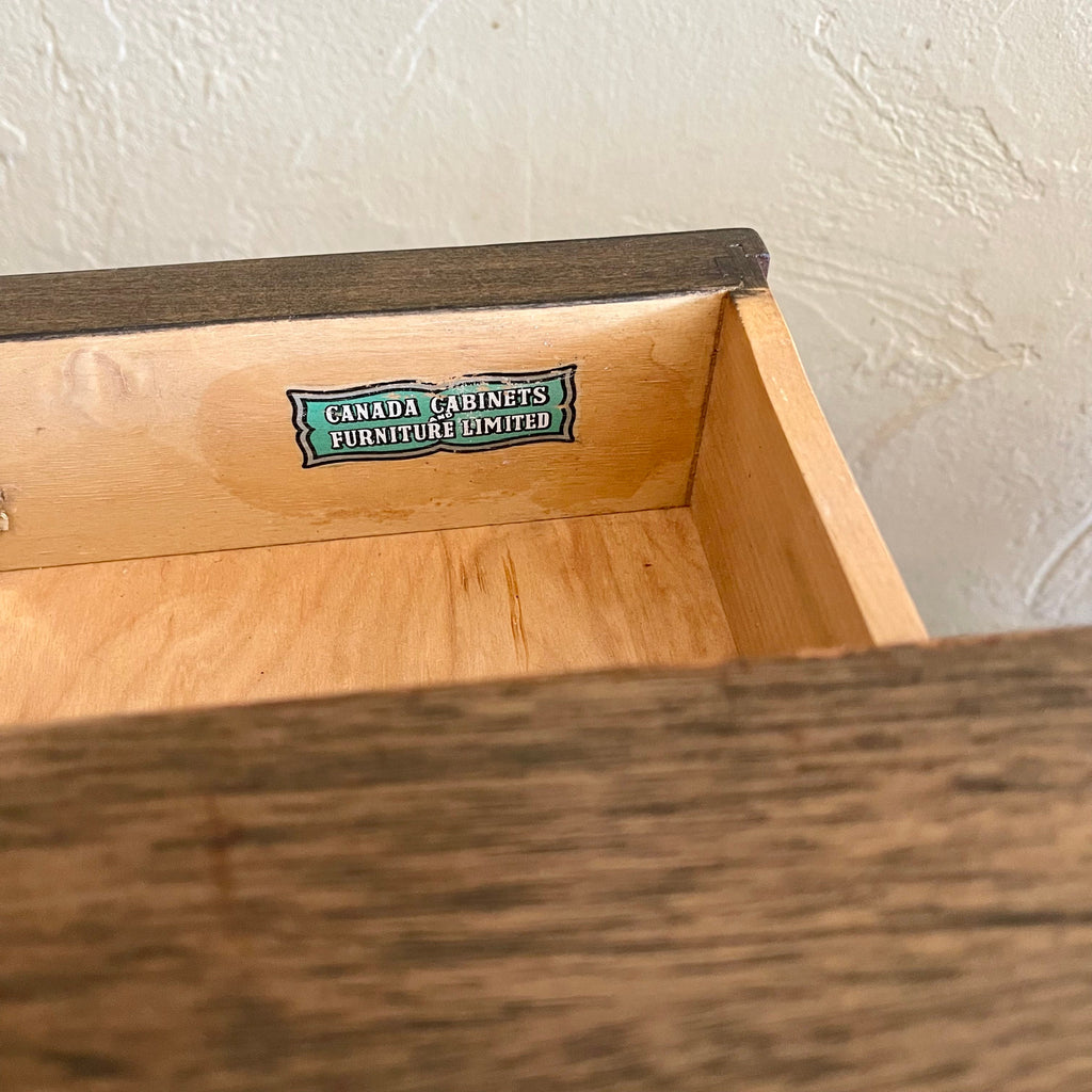 Close-up of Canada Cabinets and Furniture Limited maker’s mark inside the vintage coffee table drawer