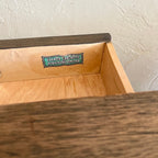 Close-up of Canada Cabinets and Furniture Limited maker’s mark inside the vintage coffee table drawer