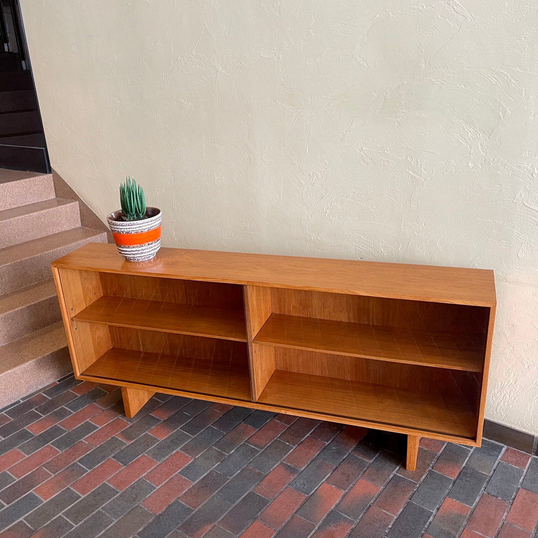  Mid-century Teak Credenza | Hutch with Adjustable Shelving. This mid-century teak credenza | hutch is perfect for storing and displaying your items. Featuring two adjustable shelves, you can customize the configuration to suit your unique home. The timeless design is ideal for both office and home environments.