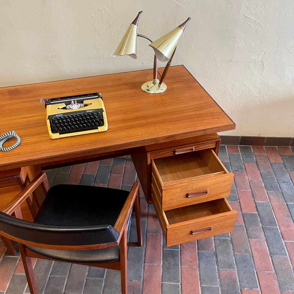 RS Associates executive teak desk with floating top and finished back with drawers open