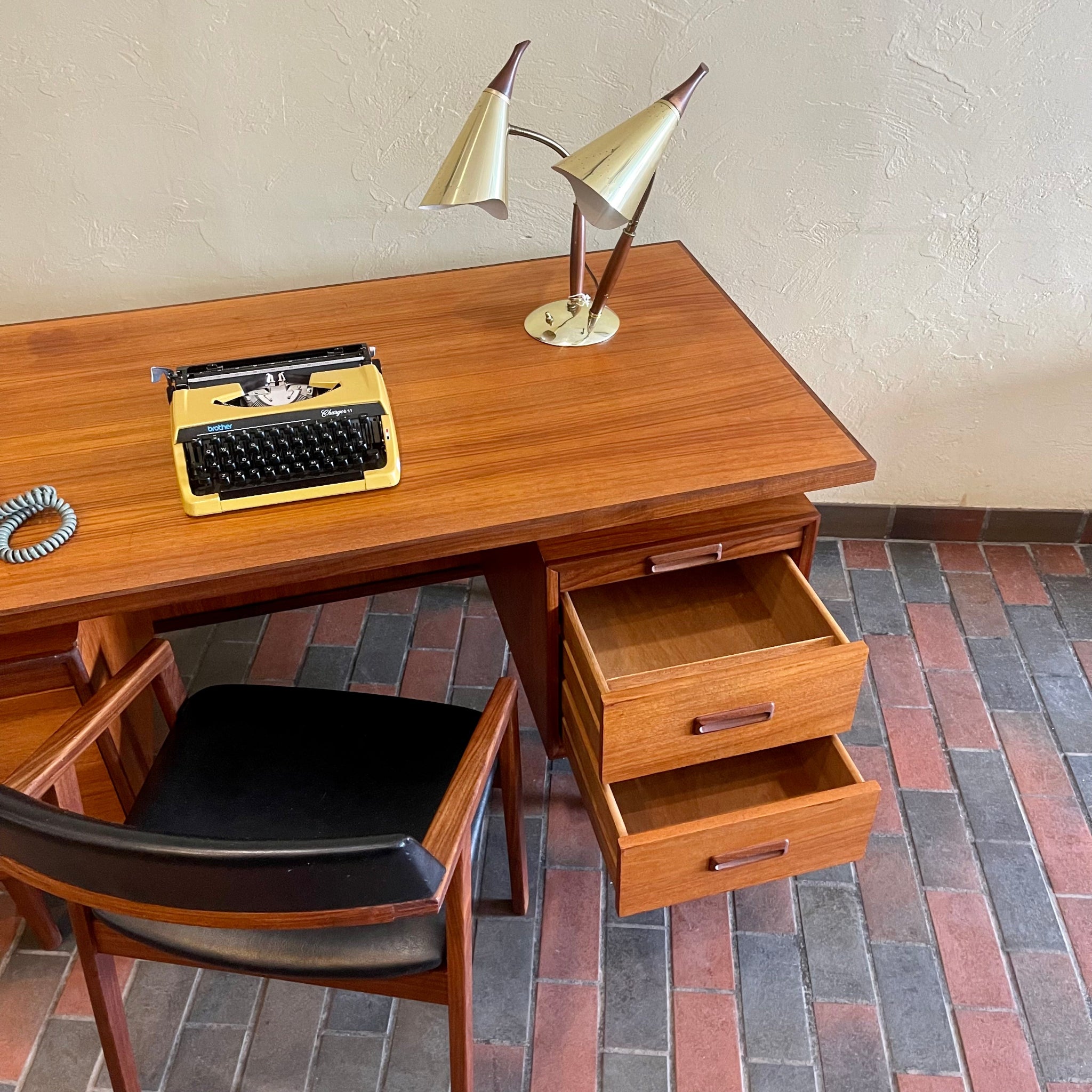 RS Associates executive teak desk with floating top and finished back with drawers open