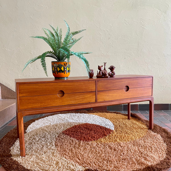 Designed by renowned Danish designer Kai Kristiansen, this piece embodies the clean lines, functional elegance, and exquisite craftsmanship characteristic of Scandinavian furniture design.