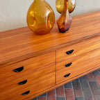 Close-up of teak grain on vintage R.S. Associates nine drawer dresser