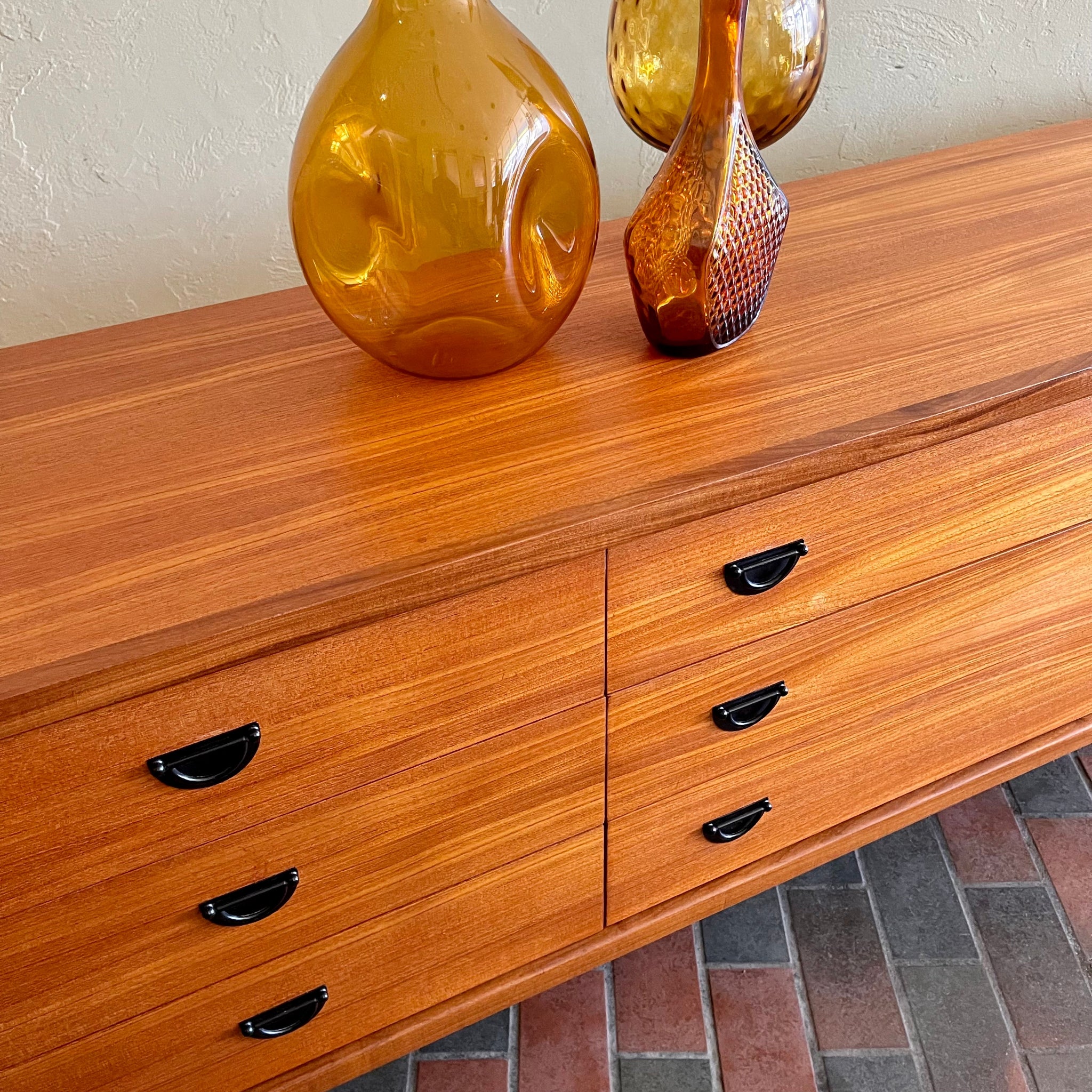 Close-up of teak grain on vintage R.S. Associates nine drawer dresser