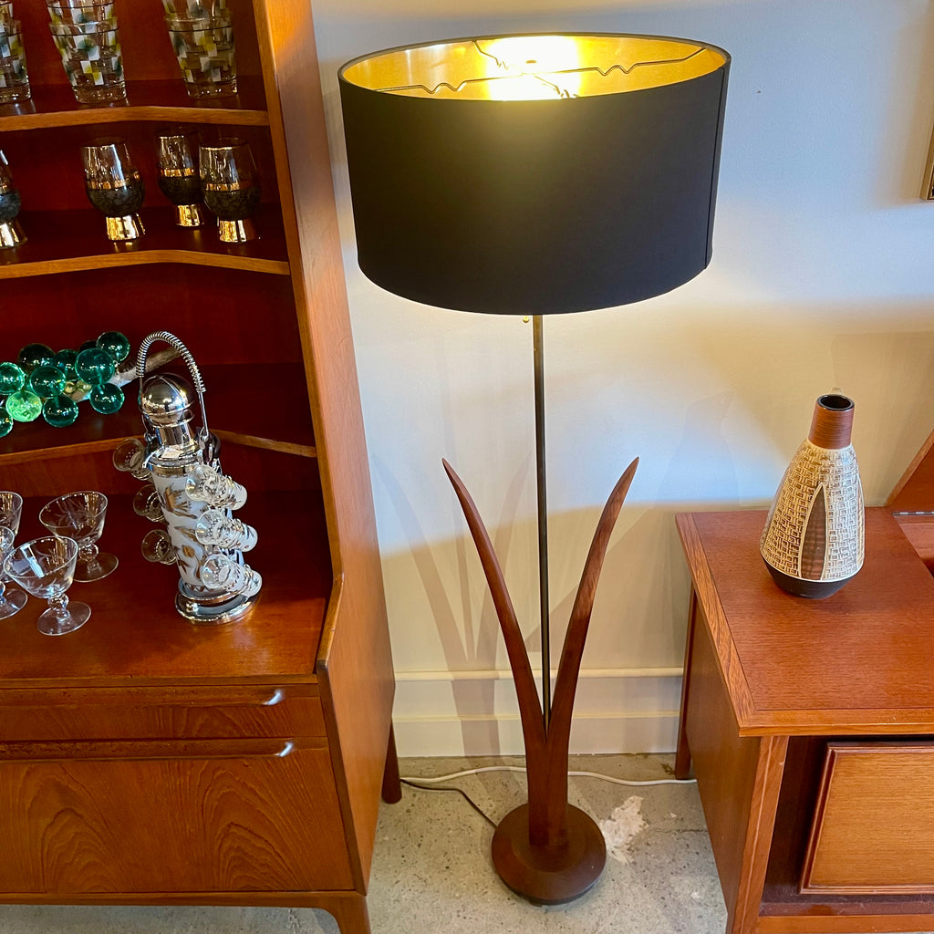 Vintage mid-century walnut floor lamp with sculptural reed-inspired base and black drum shade with gold interior.