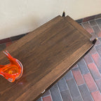 Close-up of walnut and mahogany wood grain on vintage Canadian coffee table