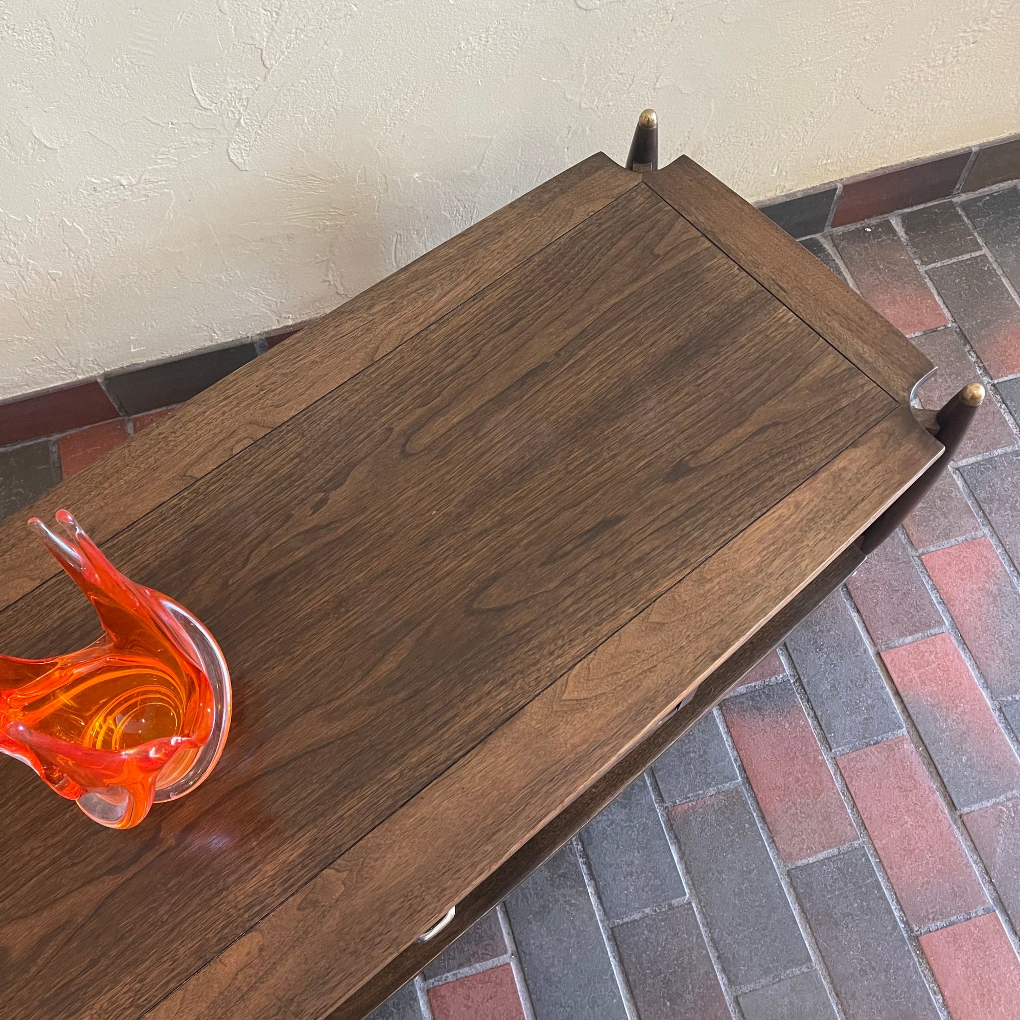 Close-up of walnut and mahogany wood grain on vintage Canadian coffee table