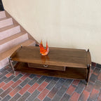 Top view of Canada Cabinets and Furniture Limited walnut and mahogany coffee table with brass-capped legs