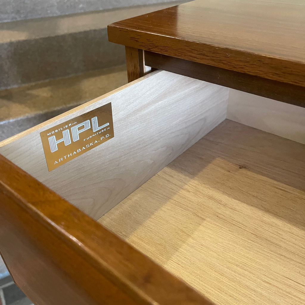Close-up of HPL Furniture label on nine drawer walnut dresser