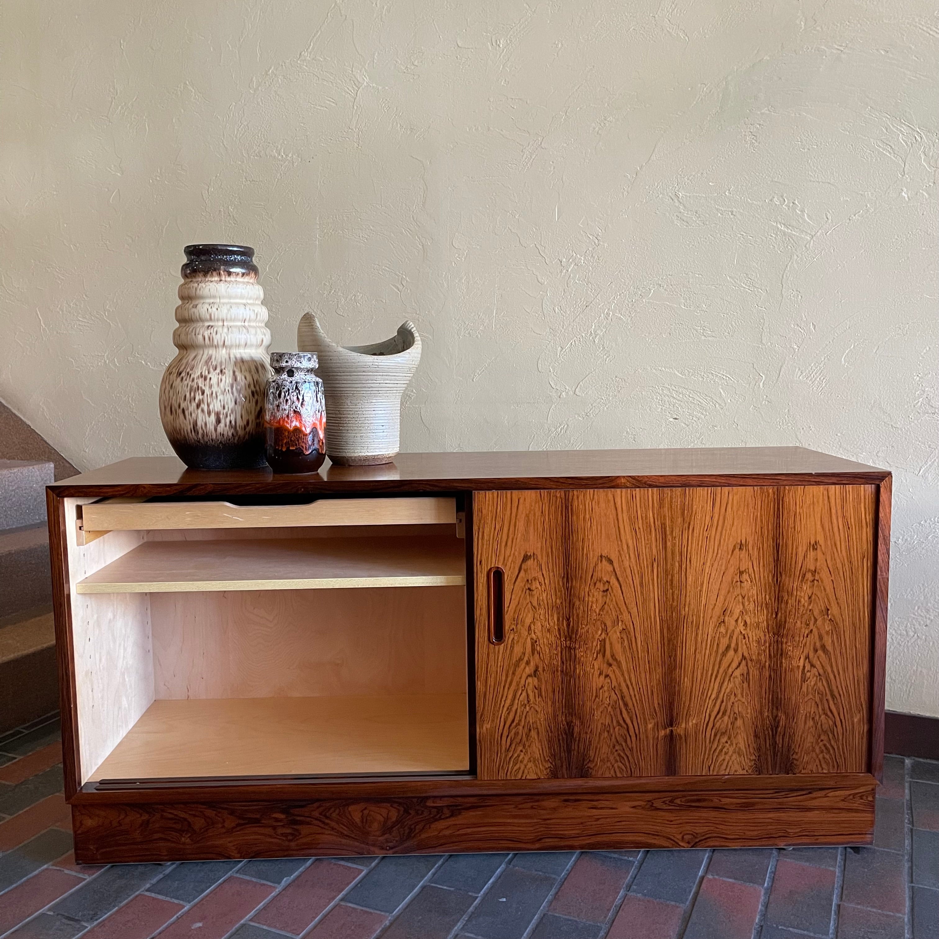 This Poul Hundevad Rosewood Credenza is crafted from rosewood, its compact size makes it perfect for apartments or smaller rooms.