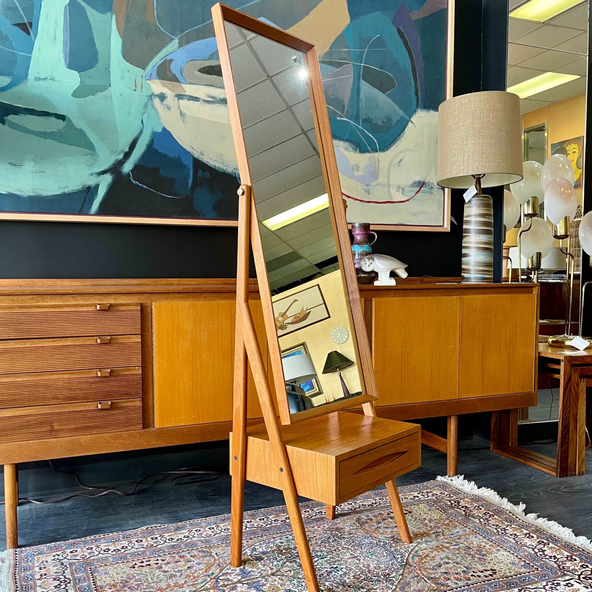 Side view of tilting Danish teak dressing mirror